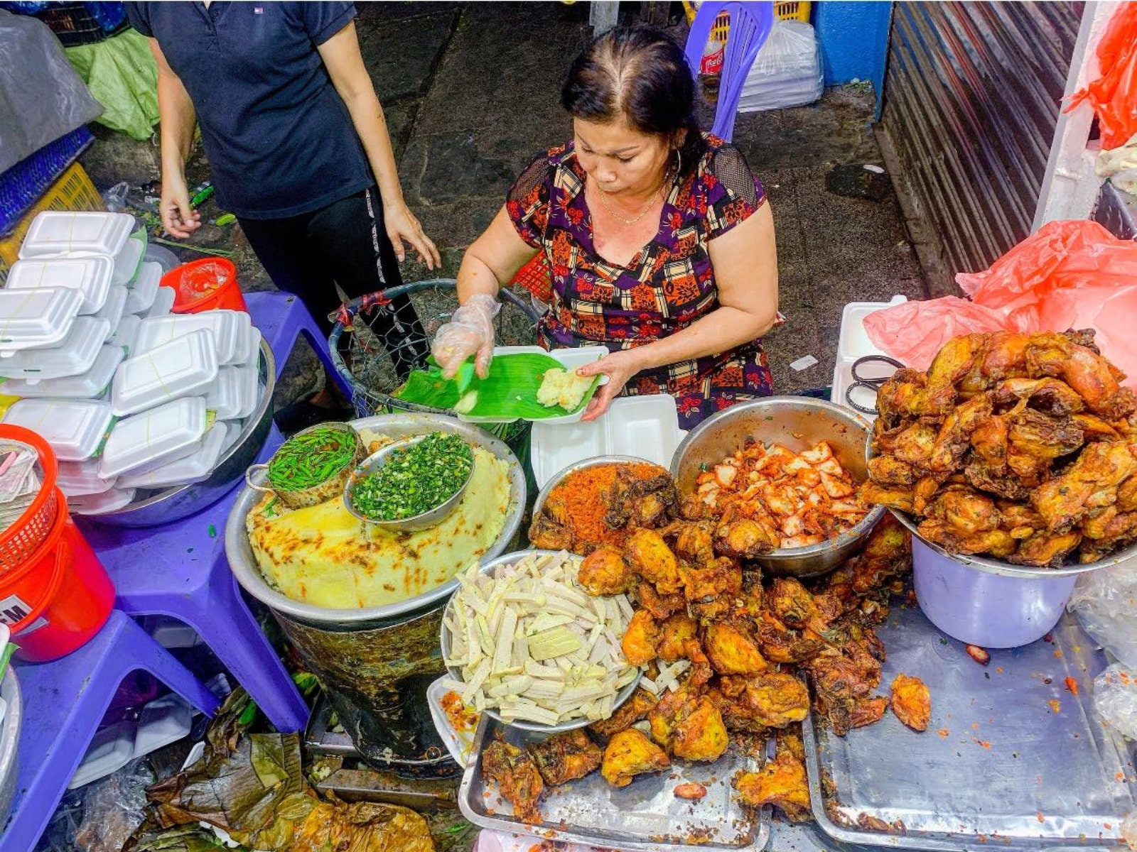 Xoi Ba Chieu is especially known for xoi man, featuring sausage, shredded chicken, and scallion oil